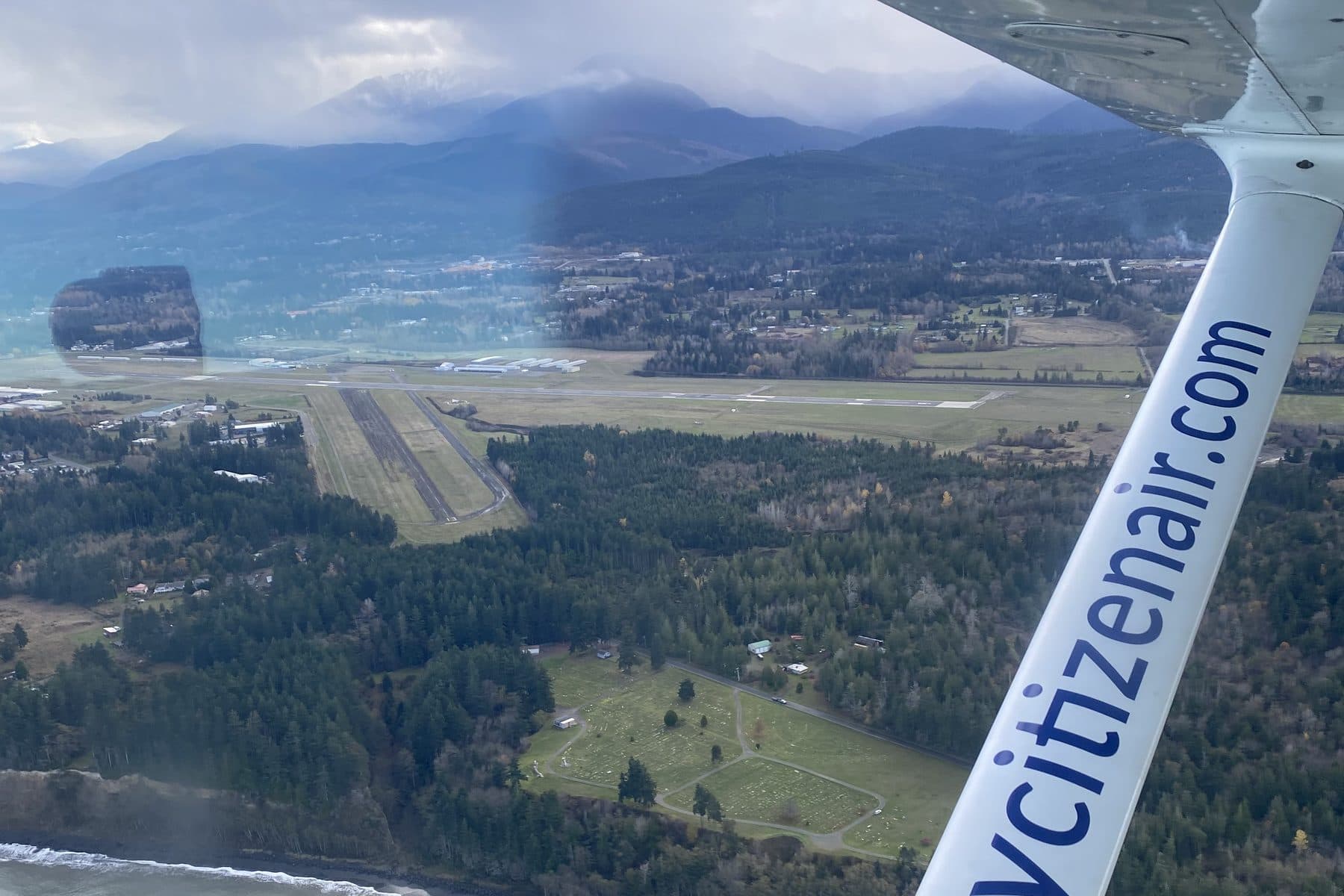 On approach over the Strait, the runway and the Olympic Mountains ahead